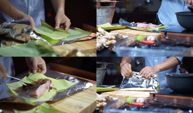 alt text: Gói cá đuối đã ướp gia vị và phết sốt sambal bằng lá chuối và giấy bạc chuẩn bị cho công đoạn nướng.